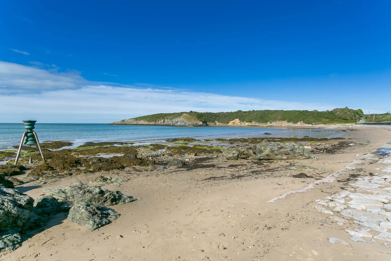 Sandy beach and coastline at Cemaes Bay