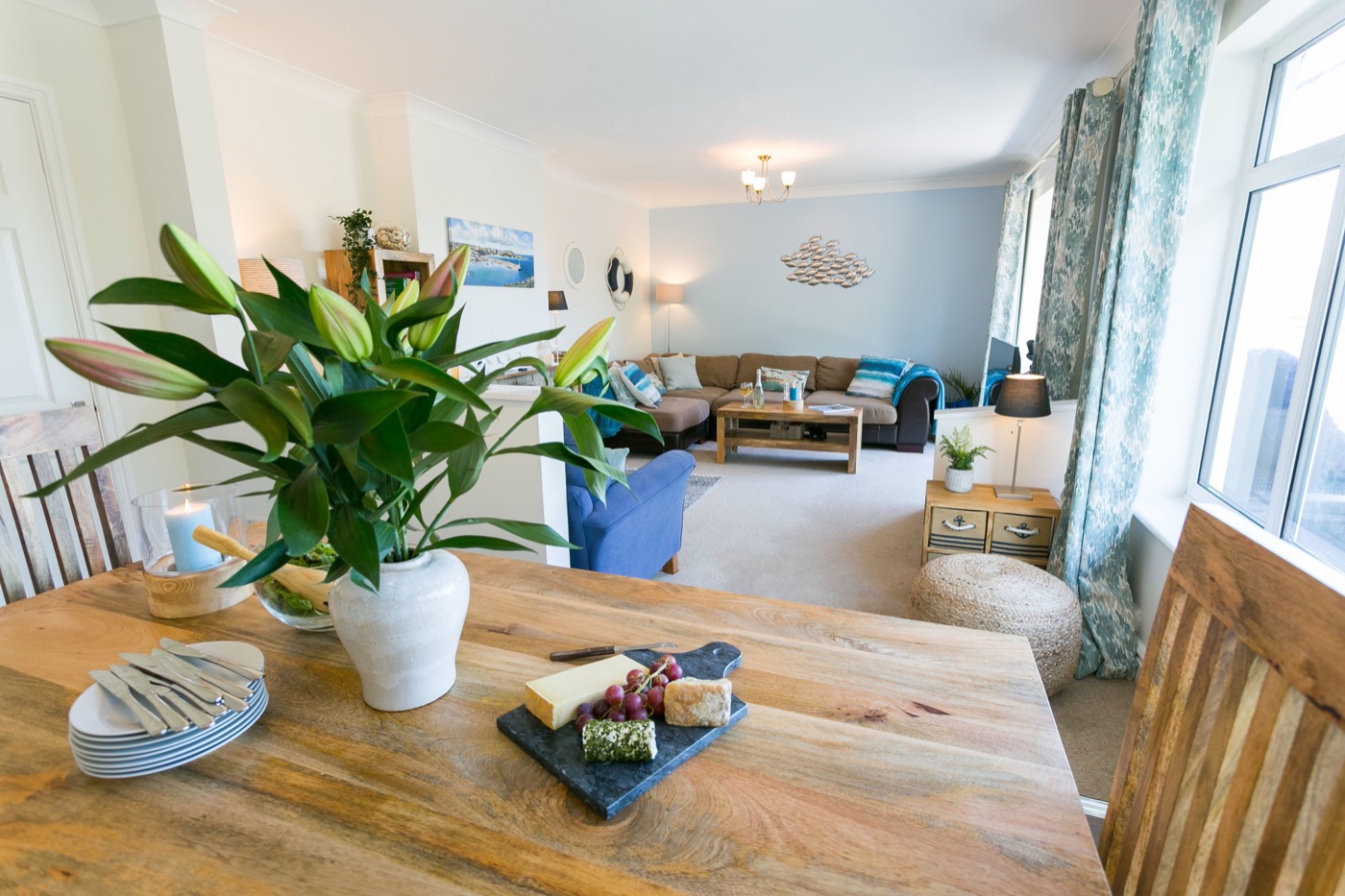 Bright dining and living area at Min-Y-Wygyr with harbour views