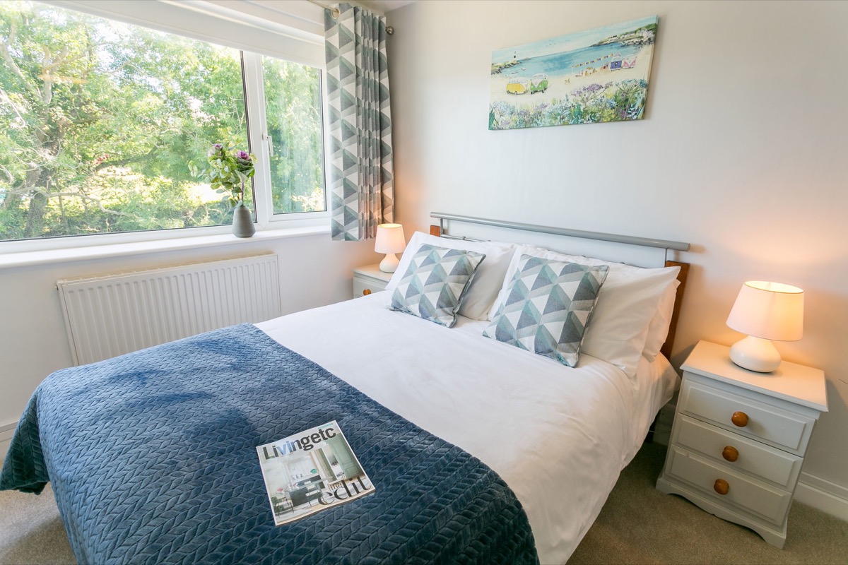 Double bedroom with soft neutral bedding