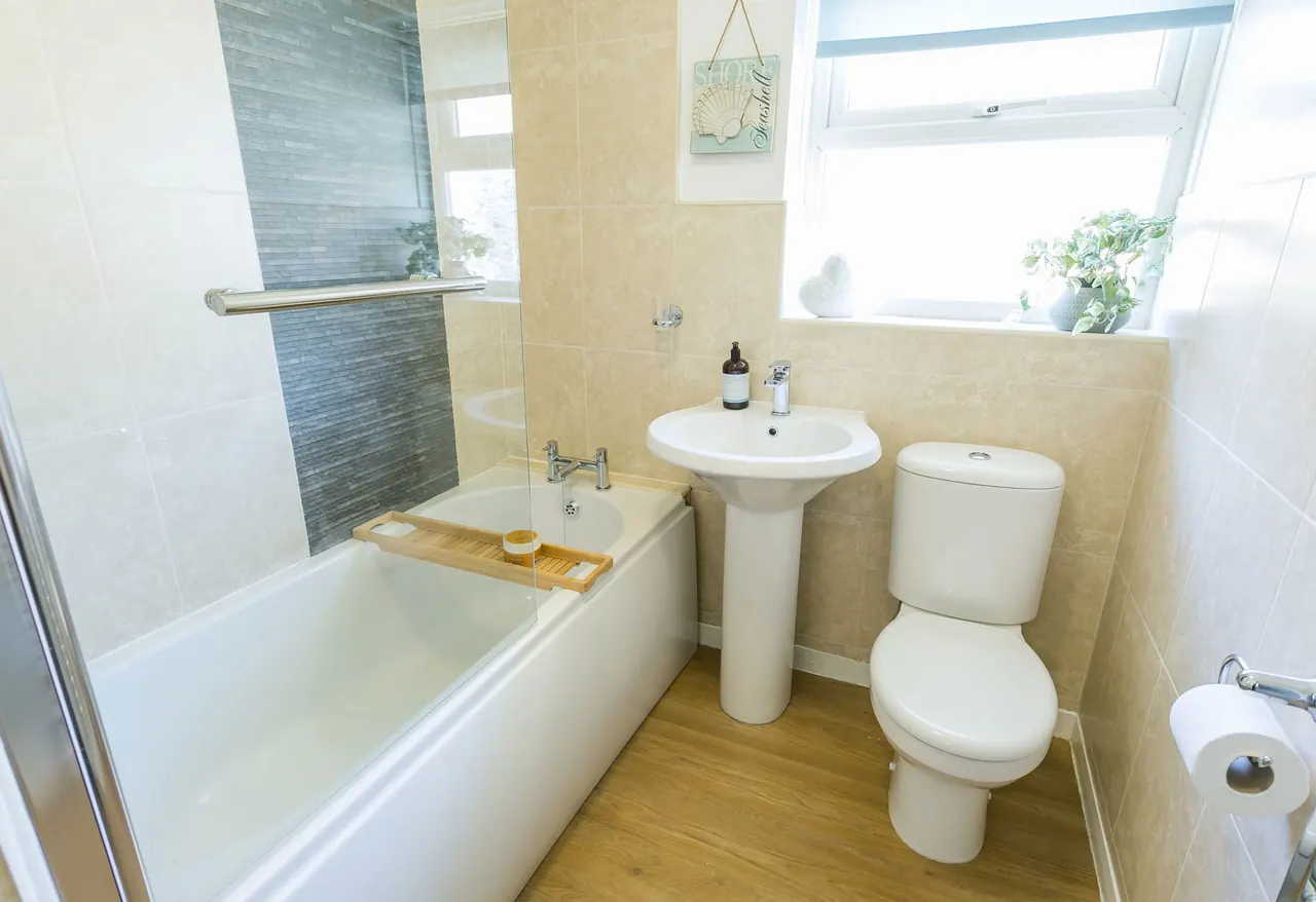 Bathroom with bath, basin and WC