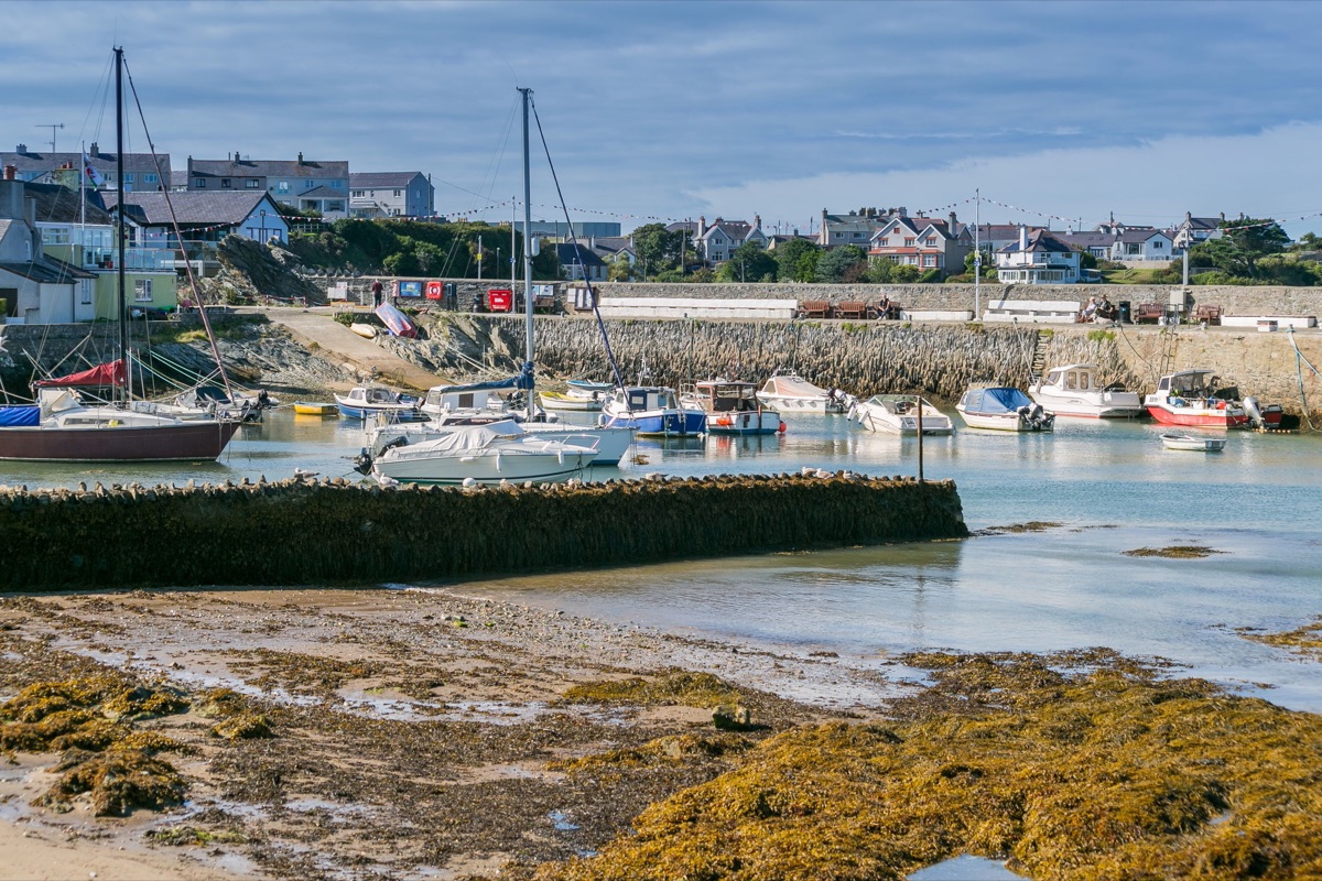 Cemaes harbour wall and boats